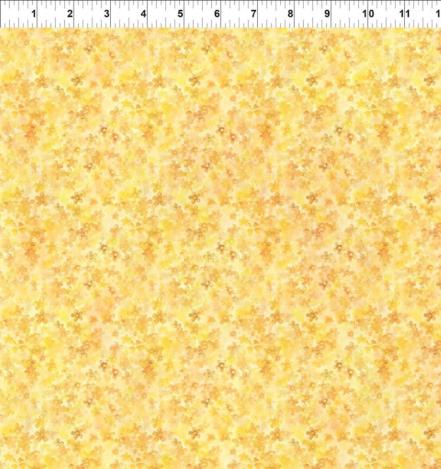 Yellow floral fabric with small scattered blossoms and vines, light weight woven