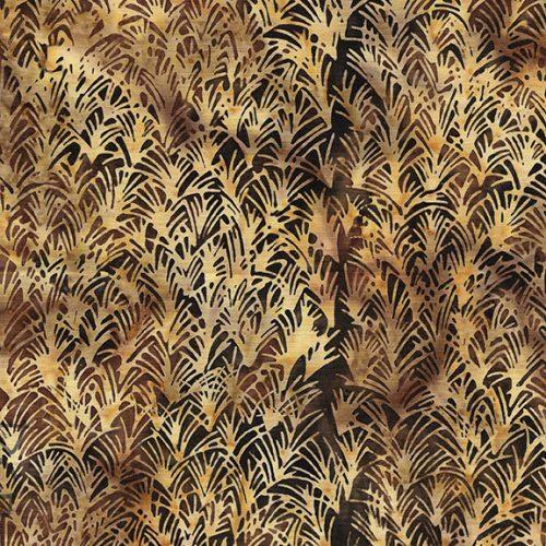 Brown batik yardage with repeating black and tan leaf fan pattern