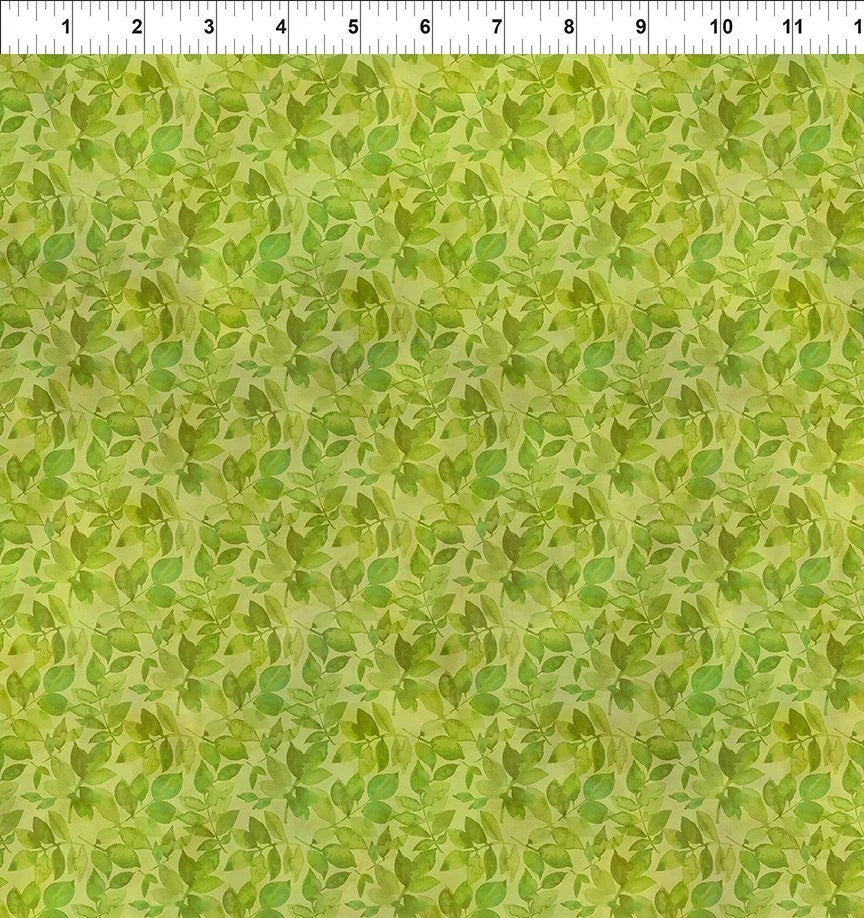 Green leaf patterned fabric with dense botanical foliage texture