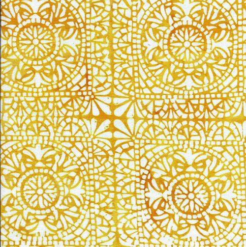Batik yardage fabric with orange and yellow mosaic floral medallion pattern