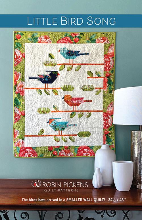 Little Bird Song quilt pattern, colorful bird blocks on white ground with floral border