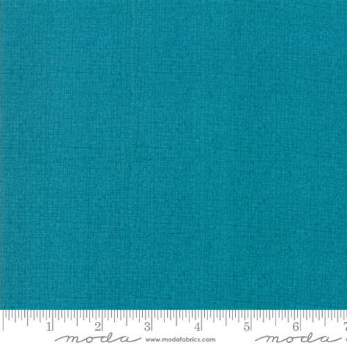 Turquoise cotton quilting fabric swatch with subtle woven texture and fine pattern