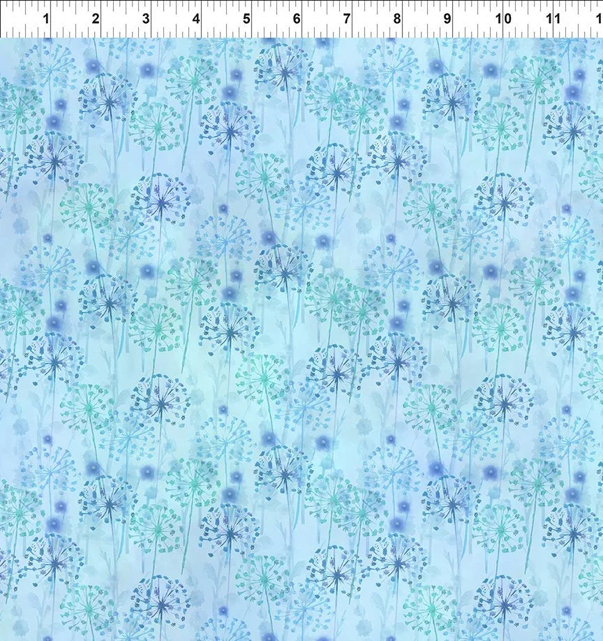 Light blue floral fabric with dandelion-like starburst prints, scattered