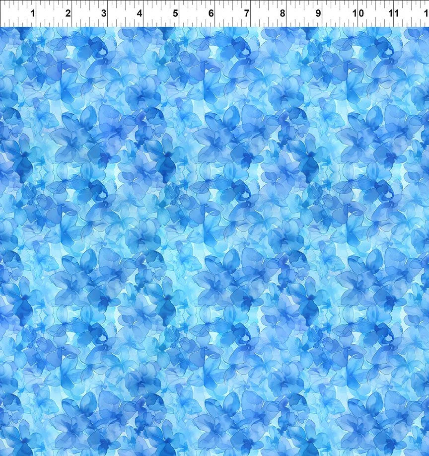 Blue hydrangea floral print fabric with scattered flower clusters