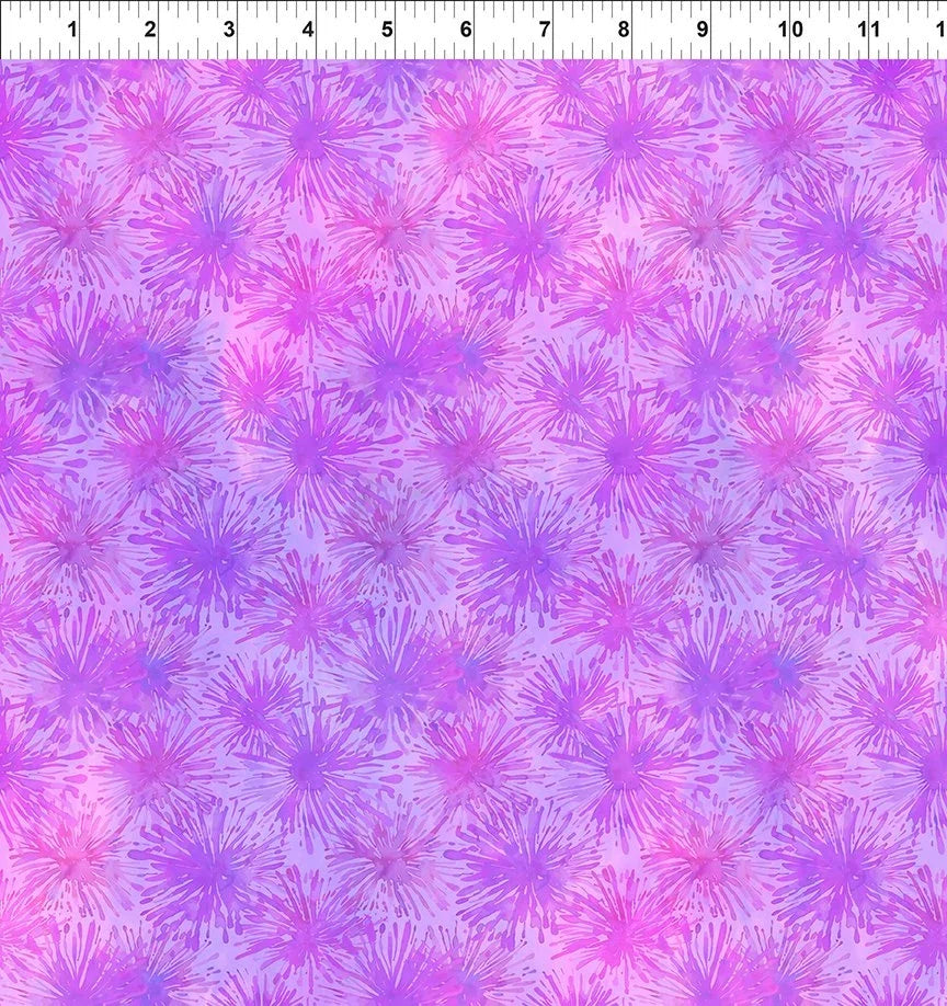 Orchid puff print fabric with repeating purple, pink, and blue flower bursts