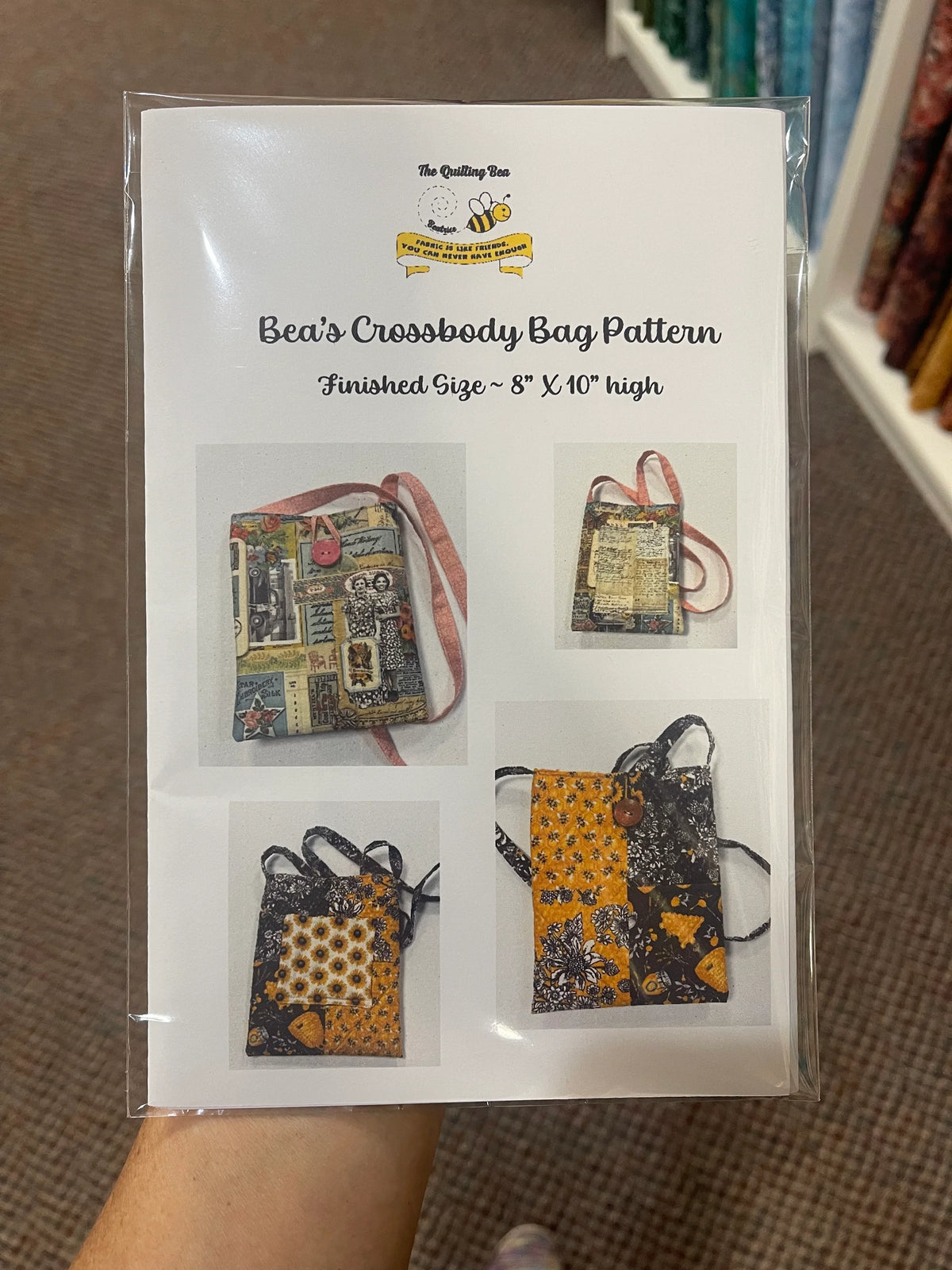 Packaged printed crossbody bag pattern in clear plastic sleeve with photos