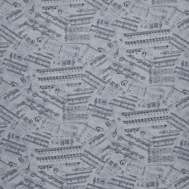 Grey fabric with musical notes, staff lines, and scale patterns in dark print