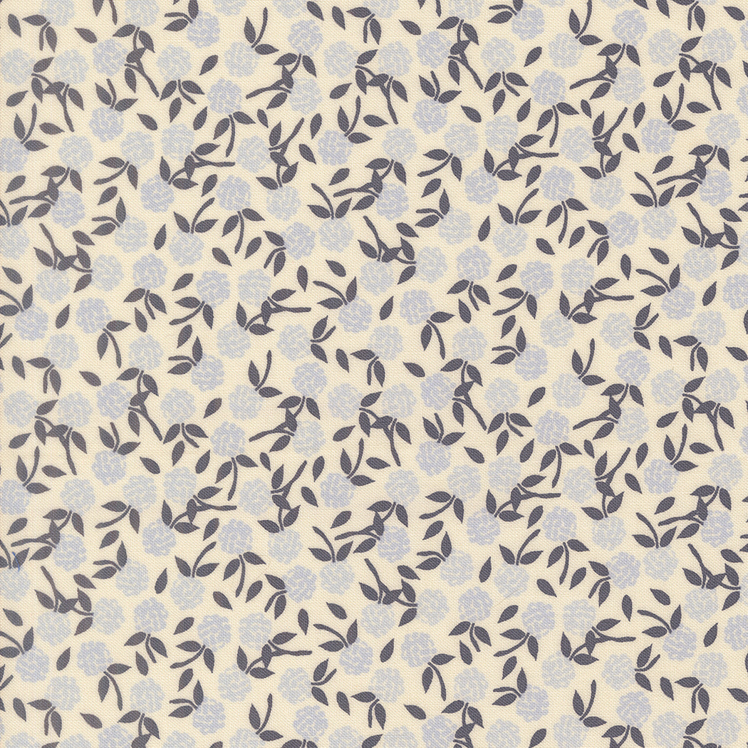 Wildbriar Porcelain fabric with a cream ground and scattered floral branches in muted blue and gray