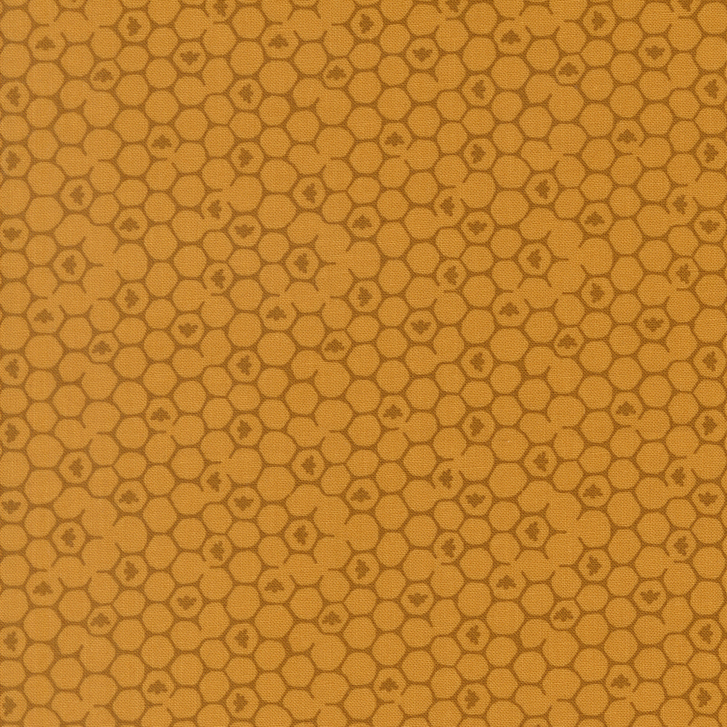 Wildbriar Golden 43226 12 fabric with a repeating honeycomb pattern and tiny floral motifs