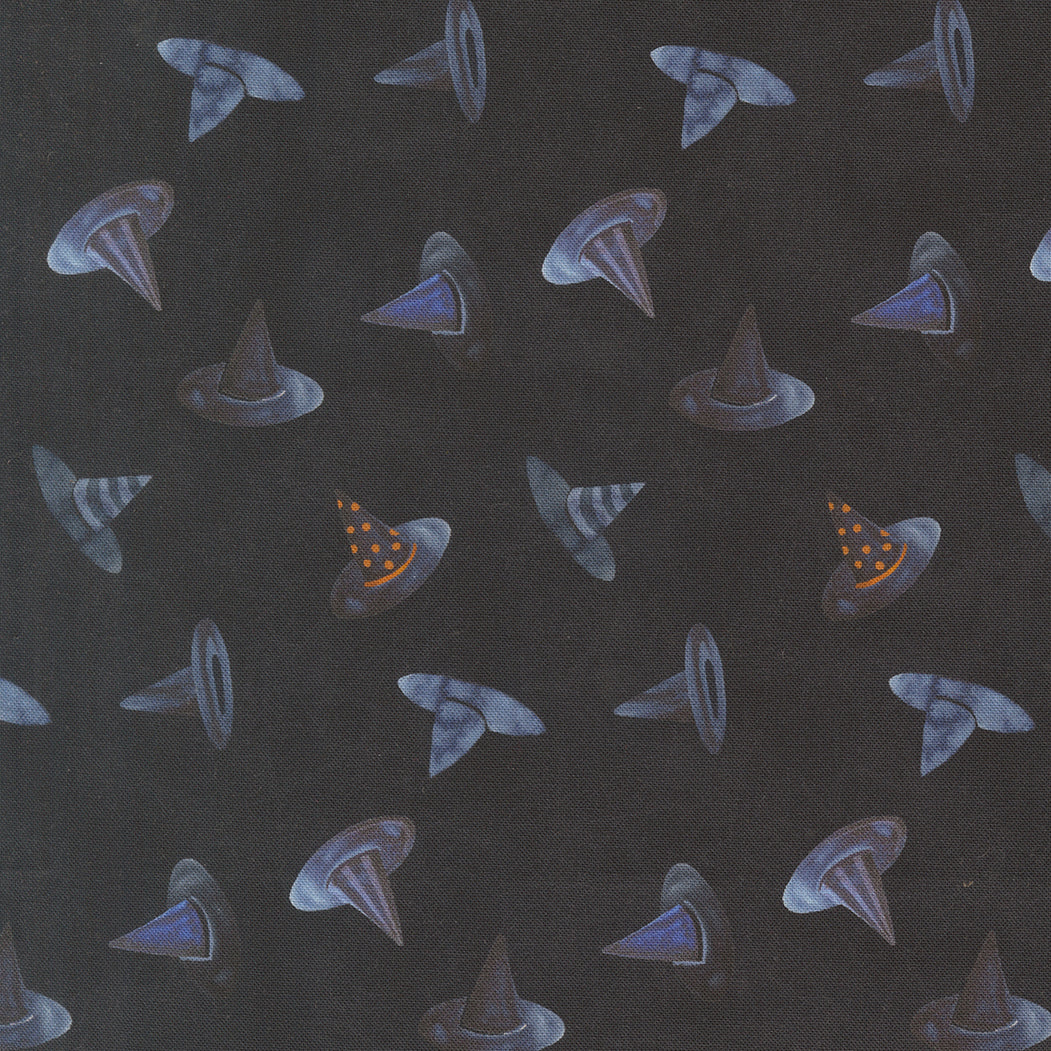 Dark fabric with scattered witch hat motifs in blue and purple with small orange accents