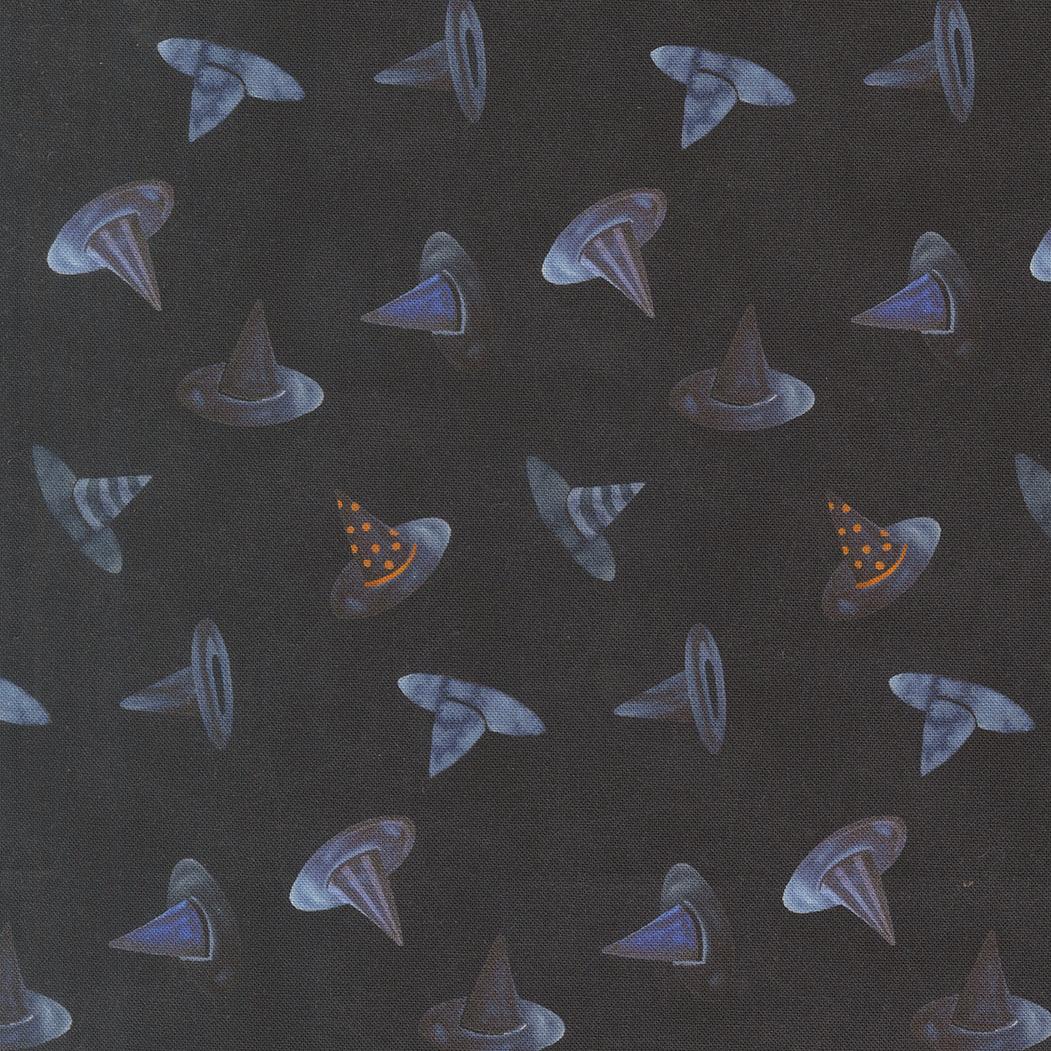Dark fabric with scattered witch hat motifs in blue and purple with small orange accents