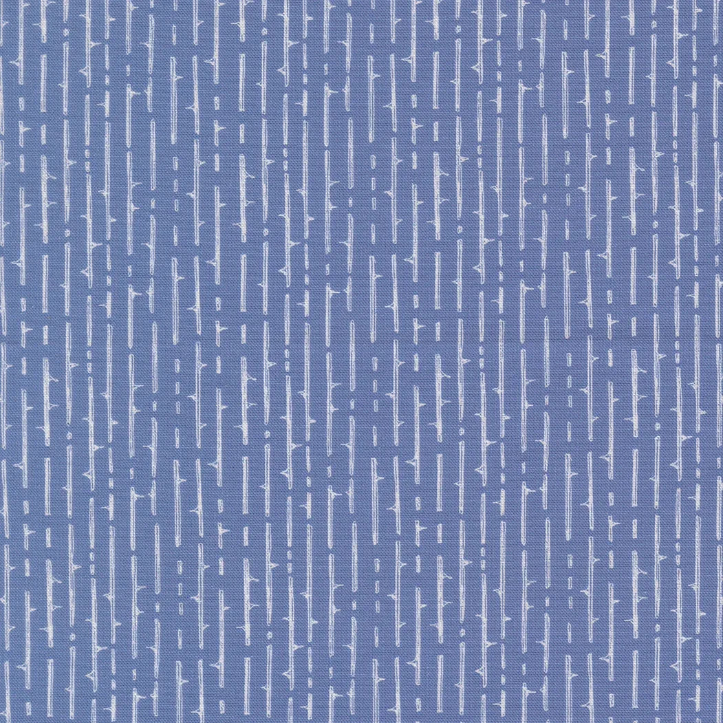 Blue vertical striped fabric with scattered cross-like motifs and small squares