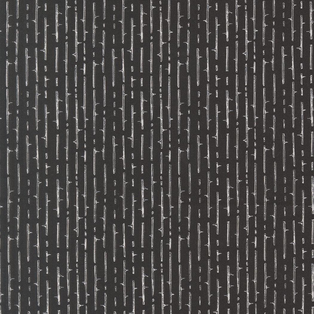Black fabric with vertical striped pattern and jagged thorn-like motifs