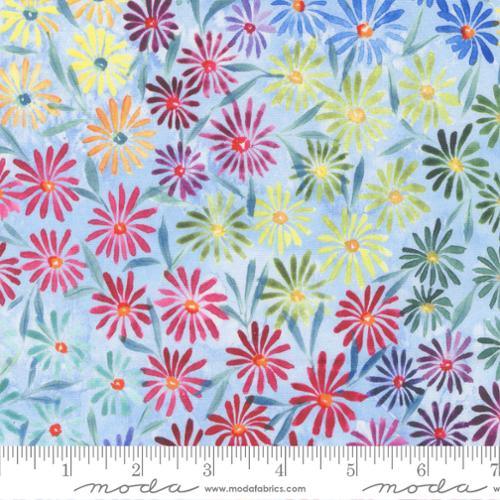 Sky-blue cotton fabric with colorful daisy-style floral pattern