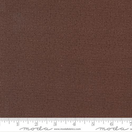 Woven mocha-brown fabric swatch with tight thatched texture