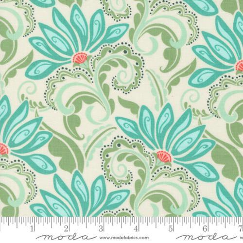 Cream printed cotton fabric with teal and green floral vines and dotted accents