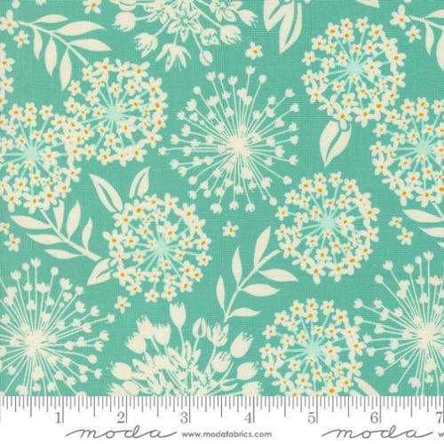 Floral cotton fabric with teal background, yellow and white dandelion blooms