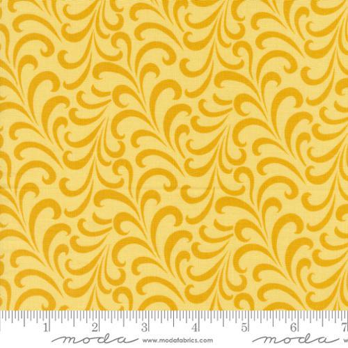 Yellow quilt fabric with swirling swirl vine pattern, small scale