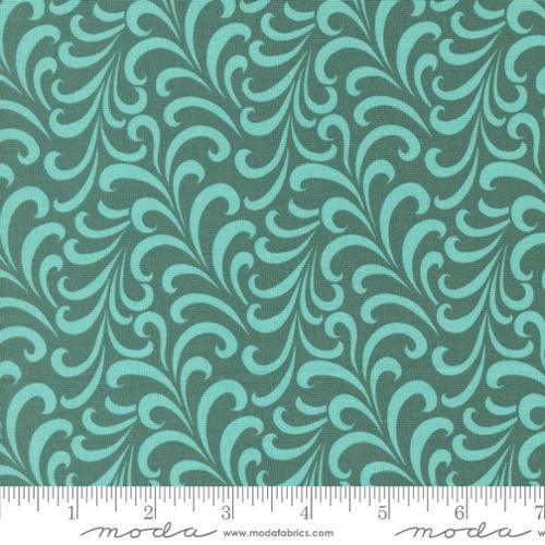 Teal fabric with repeating swirl and wave scroll pattern