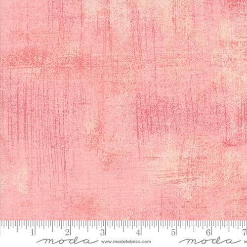 Pink grunge style quilt fabric with subtle crosshatch texture and tonal pattern