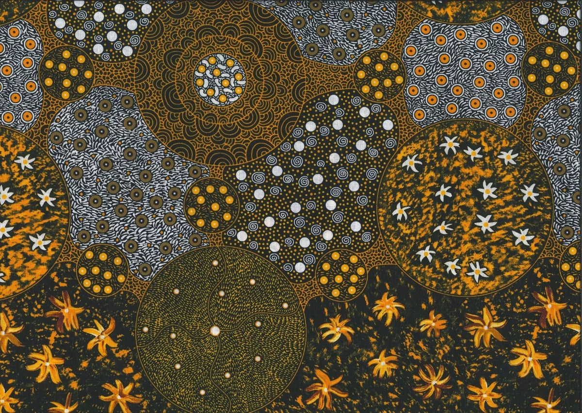 Wild Bush Tomato & Apple black gold fabric with circular patchwork motifs