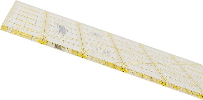 Clear quilting square ruler, angled view, with yellow grid and measurement lines