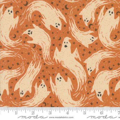 Halloween quilting fabric with cream ghost silhouettes on warm orange-brown background