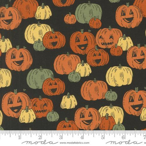 Halloween pumpkin fabric in dark gray with orange, yellow, and green jack-o'-lanterns