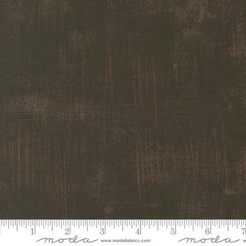 Faded denim fabric swatch with grunge texture and light distressed lines