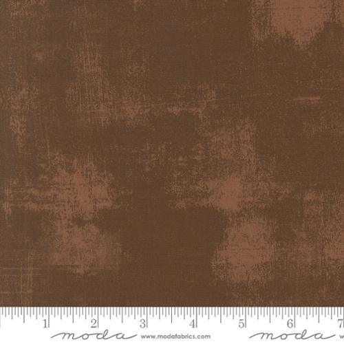 Nutmeg grunge cotton fabric with mottled distressed texture, close-up