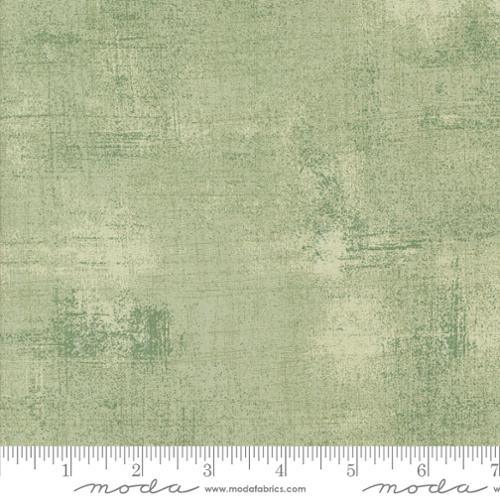 Textured fabric swatch in sage green, grunge print