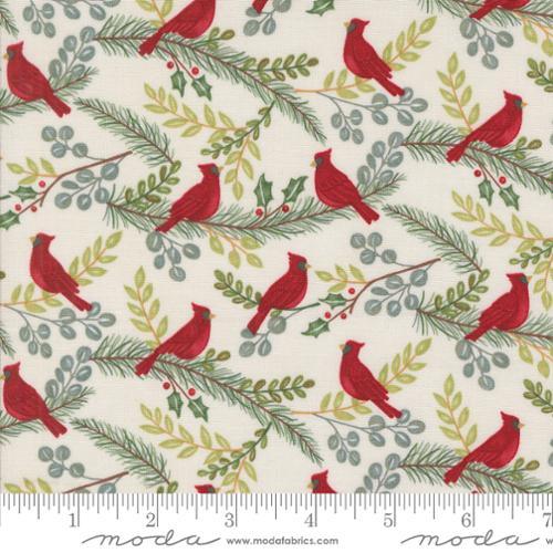Cotton quilting fabric with red cardinals on snowy white and green winter branches