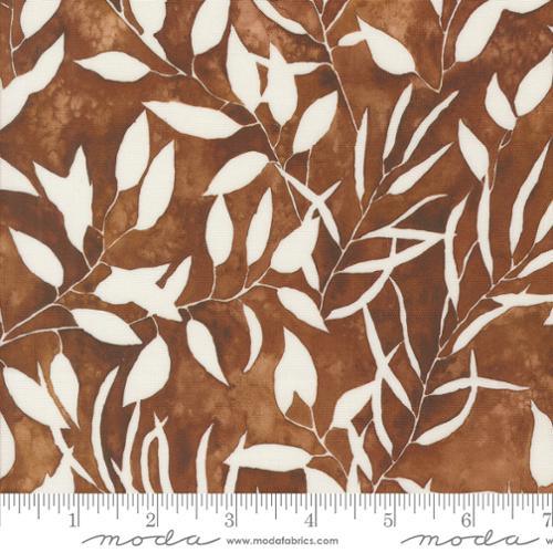Brown and cream leaf and branch patterned fabric, scattered allover design