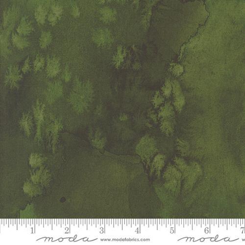 Green forest foliage fabric with layered tree silhouettes pattern