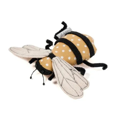 Brown and white dotted bee pincushion with black stripes and gray fabric wings