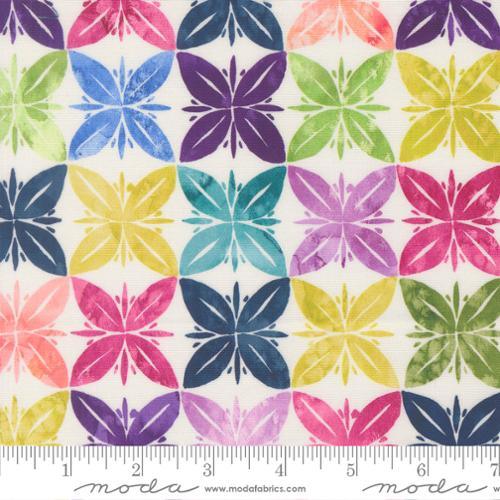 Multicolor floral starburst fabric pattern on light ground, repeated leaf blossoms