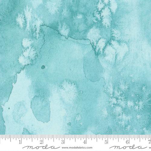 Printed cotton fabric in seafoam teal with light blue cloudlike patches and white foliage