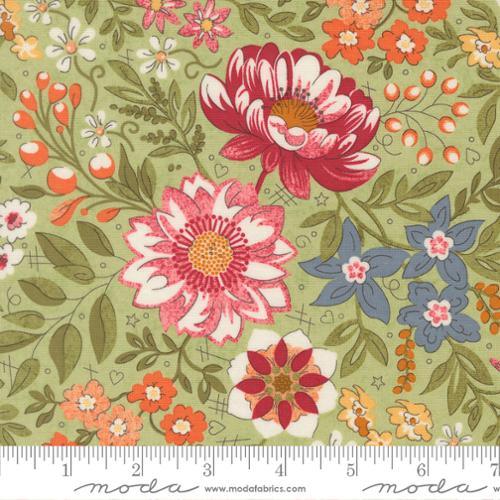 Floral cotton fabric with multicolor blossoms on light green background