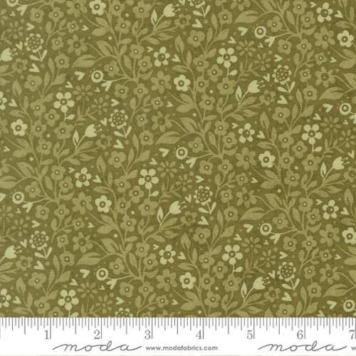Green fabric with small floral and leaf motifs in cream and olive
