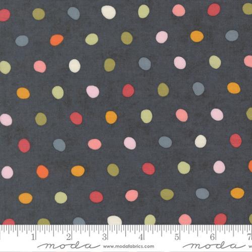 Cotton fabric with scattered multicolor small dots on dark gray background
