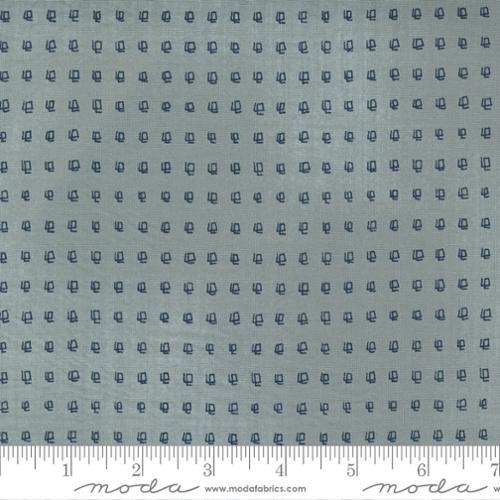 Printed cotton fabric with small repeating blue icons on white ground