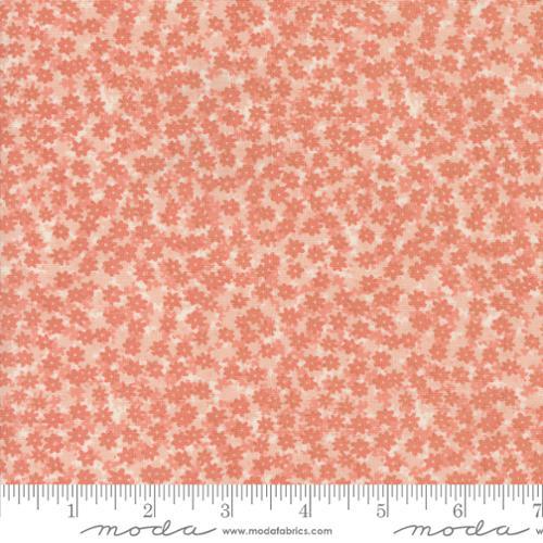 Floral quilting fabric with small light-pink flower sprigs on peach background