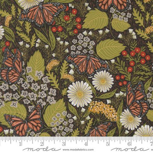 Butterfly and floral fabric with metallic gold accents on dark background
