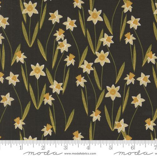 Black daffodil floral fabric with metallic gold flowers and green stems