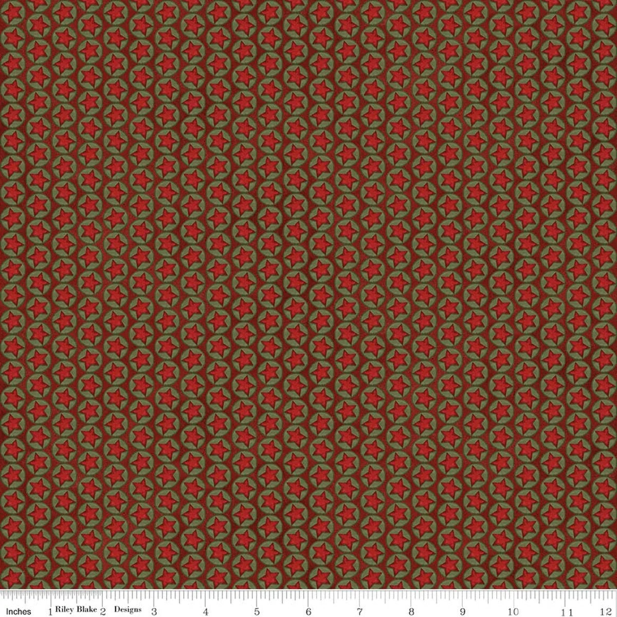 Christmas quilting fabric in red with repeating green star pattern