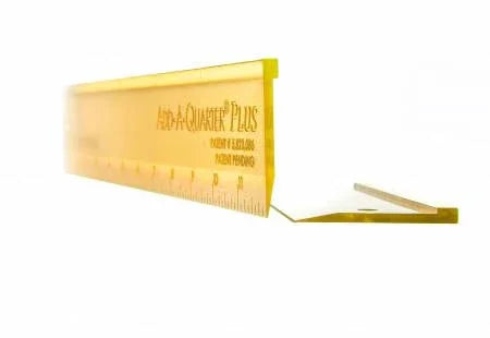 Yellow quilting ruler with folding guide and quarter-inch markings