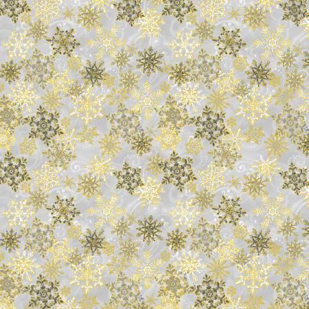 Metallic snowflake fabric with silver and gold starburst flakes on light ground