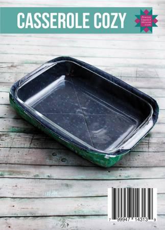 Rectangular casserole cozy with dark fabric and green trim, covering a baking dish