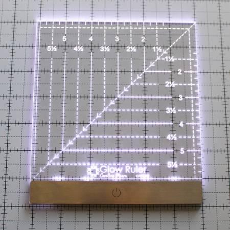 6in square acrylic ruler close-up with centimeter markings, right-angle and diagonal guides