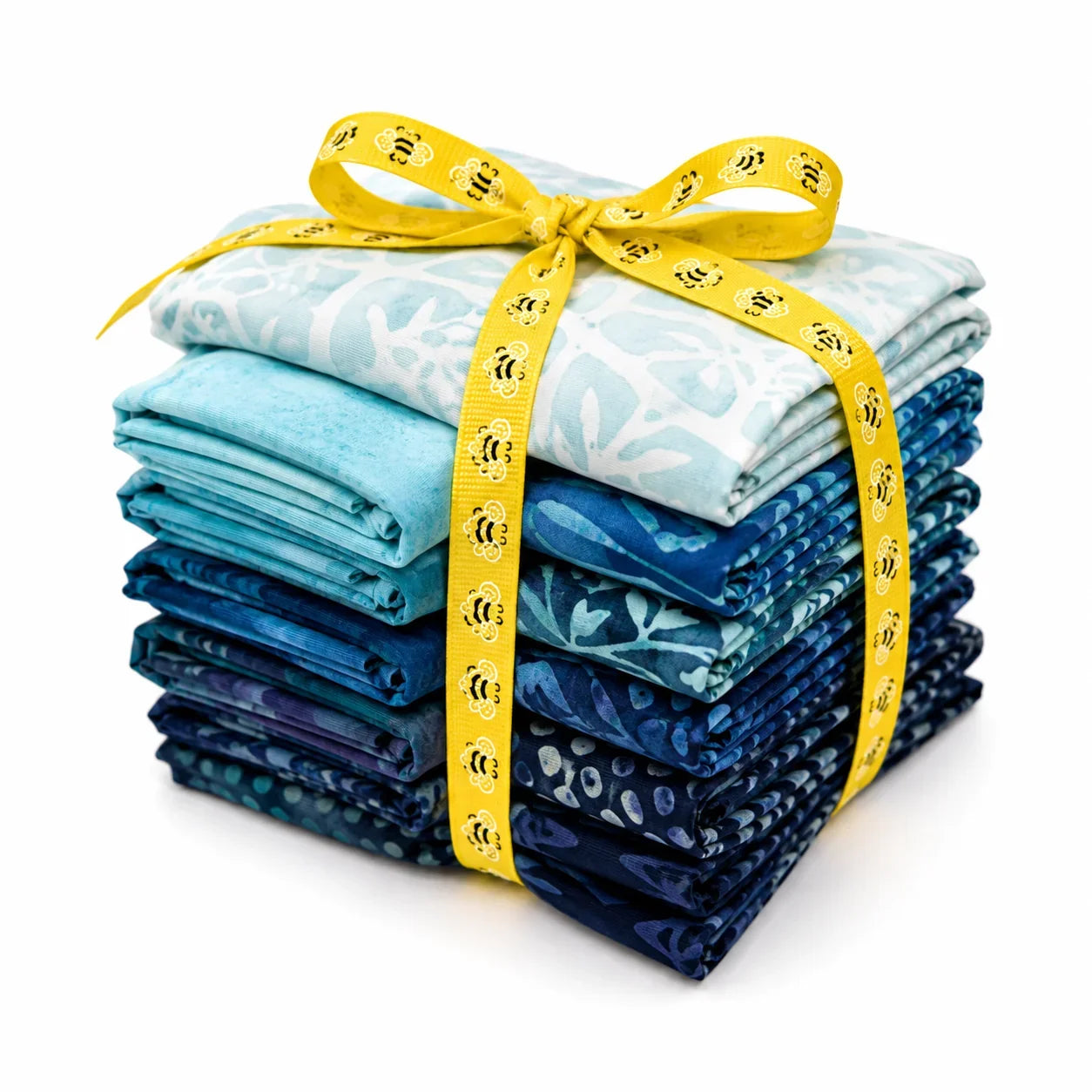 Batik fabric fat quarter stack in blue tones with yellow patterned ribbon tie